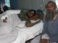 Miraj (l) and his father at the hospital
